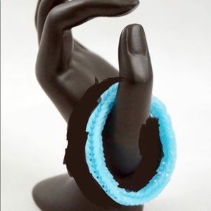 Light blue rubber band braclets.